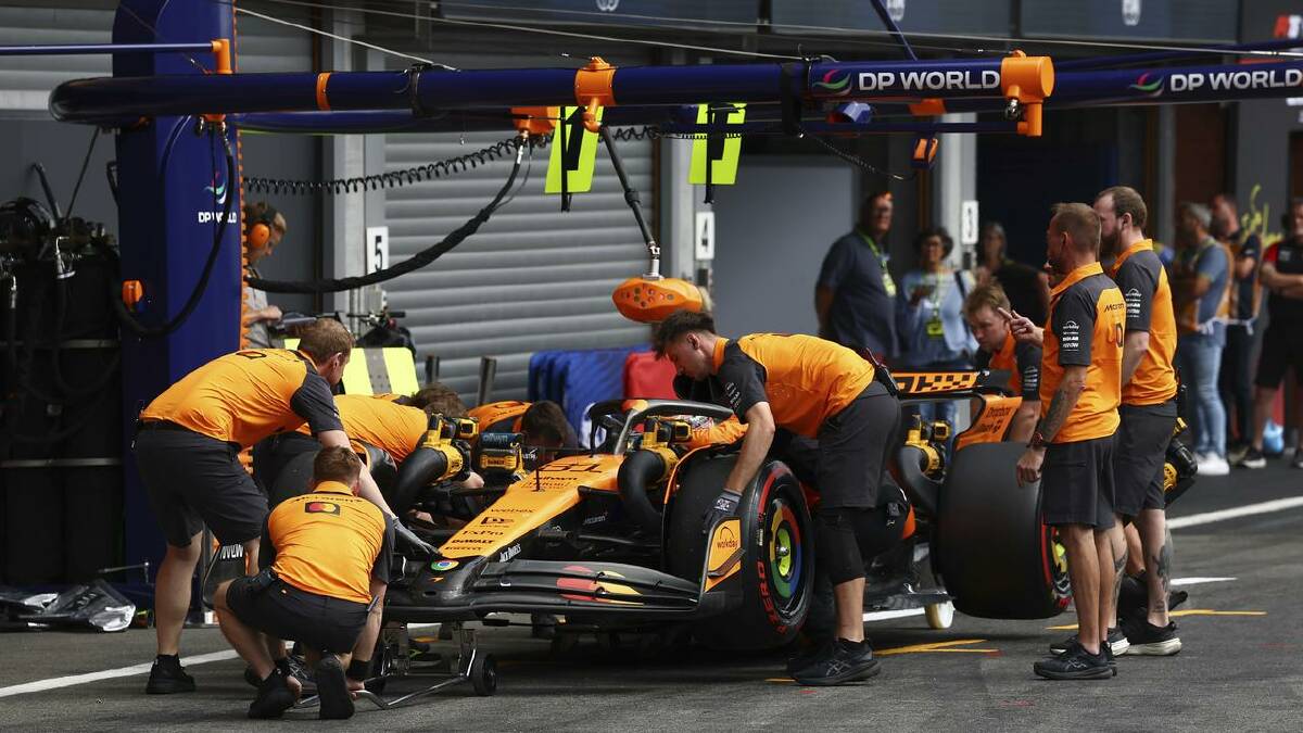 Crew work on the car of McLaren driver Oscar Piastri druing qualifying for the Belgian Grand Prix. (AP PHOTO) Crew work on the car of McLaren driver Oscar Piastri druing qualifying for the Belgian Grand Prix. (AP PHOTO)