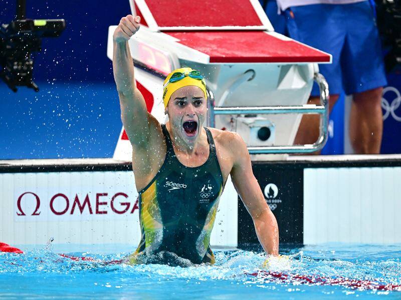 Kaylee McKeown, here celebrating Olympic gold last year, is back in action at the world titles. Photo: Dave Hunt/AAP PHOTOS