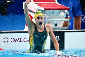 Kaylee McKeown, here celebrating Olympic gold last year, is back in action at the world titles. Photo: Dave Hunt/AAP PHOTOS