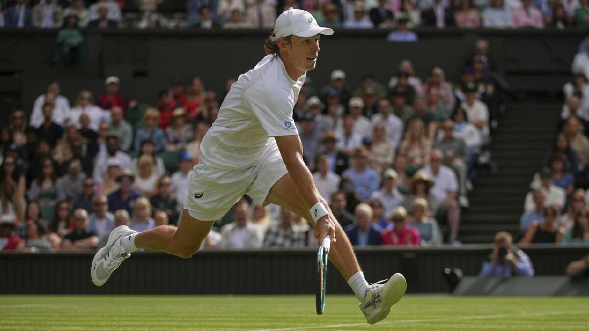 A fit-again Alex de Minaur races to a Novak Djokovic drop shot at Wimbledon. (AP PHOTO)