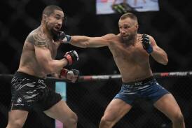 Robert Whittaker and Reinier de Ridder battle it out during their UFC middleweight fight in the UAE. Photo: AP PHOTO