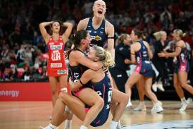 Vixens players were elated after their nail-biting one-goal preliminary final win over the Swifts.  Photo: Bianca De Marchi/AAP PHOTOS