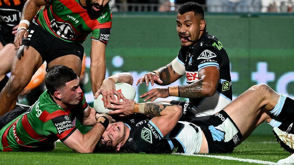 Cronulla's Nicho Hynes is denied a try after being held up by South Sydney's Lewis Dodd. (Dan Himbrechts/AAP PHOTOS)