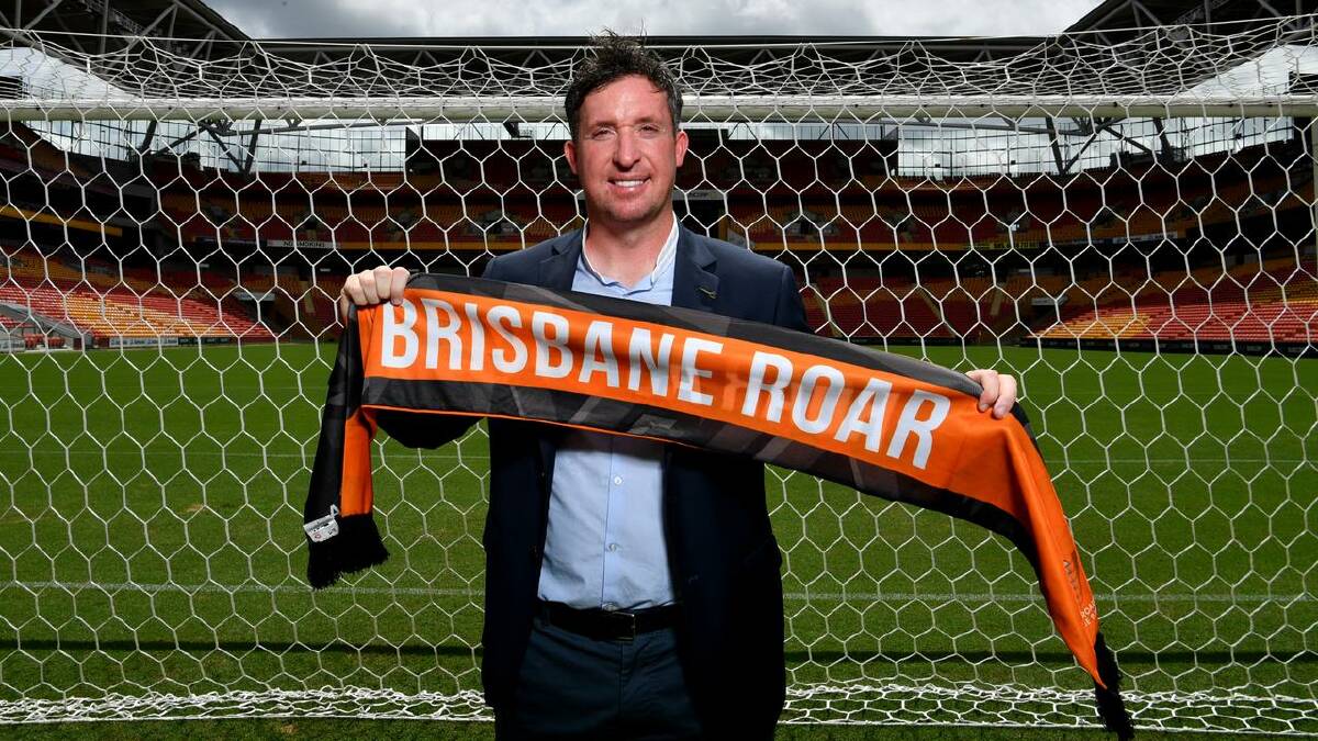 Robbie Fowler holds a Brisbane Roar scarf at his unveiling as coach in 2020. (Darren England/AAP PHOTOS) Robbie Fowler holds a Brisbane Roar scarf at his unveiling as coach in 2020. (Darren England/AAP PHOTOS)