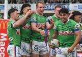 Matthew Timoko (second right) has led ladder leaders Canberra to an emphatic win over Newcastle. Photo: Mick Tsikas/AAP PHOTOS