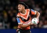 Latu Fainu is only five games into his first stint as a regular starting halfback for the Tigers. Photo: Steven Markham/AAP PHOTOS