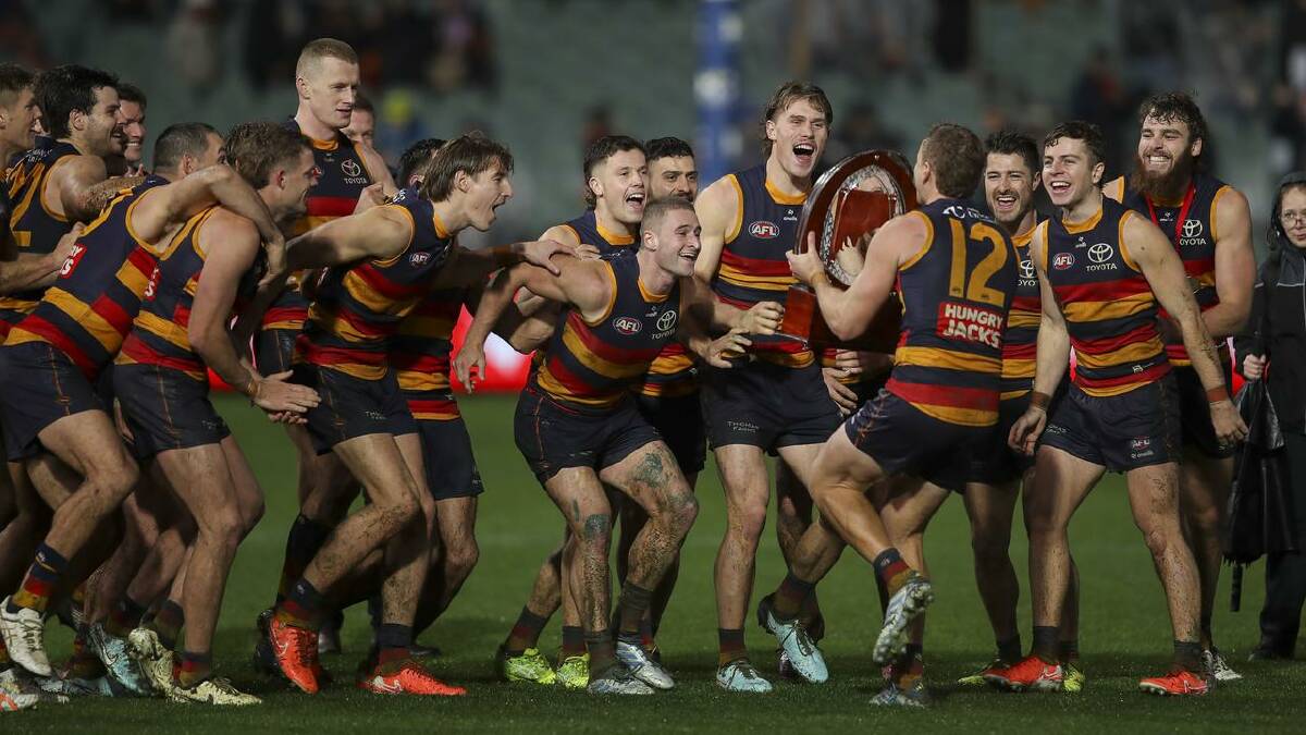 Adelaide's players celebrate their record win over Port. (Matt Turner/AAP PHOTOS) Adelaide's players celebrate their record win over Port. (Matt Turner/AAP PHOTOS)