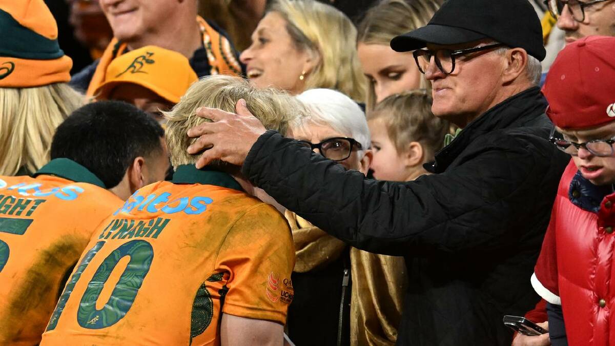 Tom Lynagh gets a pat on the head from dad after the first Lions Test loss. (Darren England/AAP PHOTOS) Tom Lynagh gets a pat on the head from dad after the first Lions Test loss. (Darren England/AAP PHOTOS)