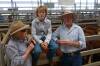 Tony Reardon, Brooklyn Pastoral Company, Mansfield, with son Tom, and mother Margo, with their top pen of Hereford steers at Barnawartha, Wednesday. These steers, 358kgs, sold for $1145.